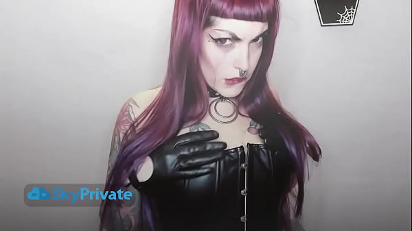 dominatrix and her black latex gloves