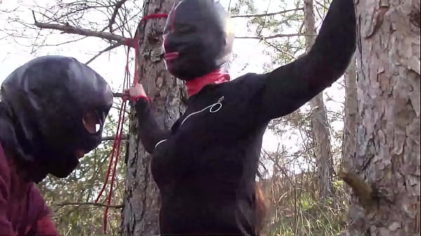 masked black chick gets tied to tree and d with sex toys